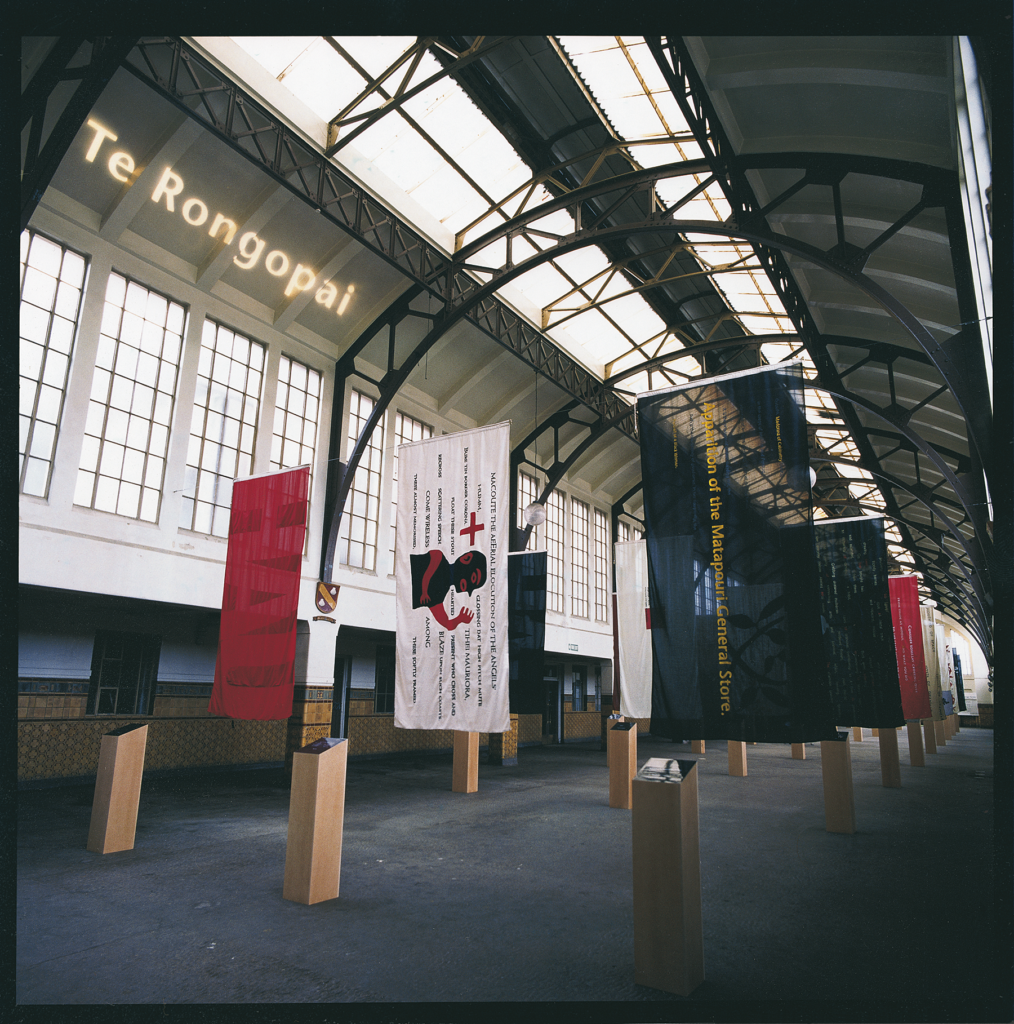 Station of Earth-Bound Ghosts flags with Te Rongopai projected above